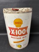A Shell X-100 Motor Oil Multigrade 20 W/40 five gallon drum.
