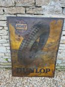 A large and early Fort Dunlop printed tin advertising sign featuring a tyre on wire spoked wheel, 36