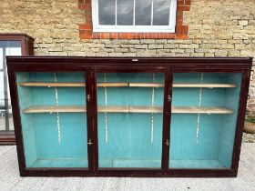 A large glazed wall mounting display cabinet with adjustable height shelves, plaque for Potters (