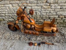 A large wooden model of a motorcycle, 69 1/2" long, 38" tall x 20" wide.