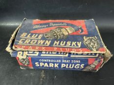 A shop counter dispensing box for Blue Crown Husky Spark Plugs.