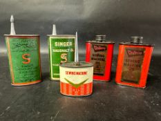 Five assorted sewing machine oil cans.