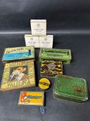 An Olivier Cigarettes packets display card and various tobacco and cigarette tins.