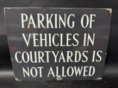 A 'Parking of Vehicles in Courtyards is Not Allowed' enamel sign, 18 x 14".