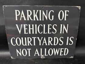 A 'Parking of Vehicles in Courtyards is Not Allowed' enamel sign, 18 x 14".