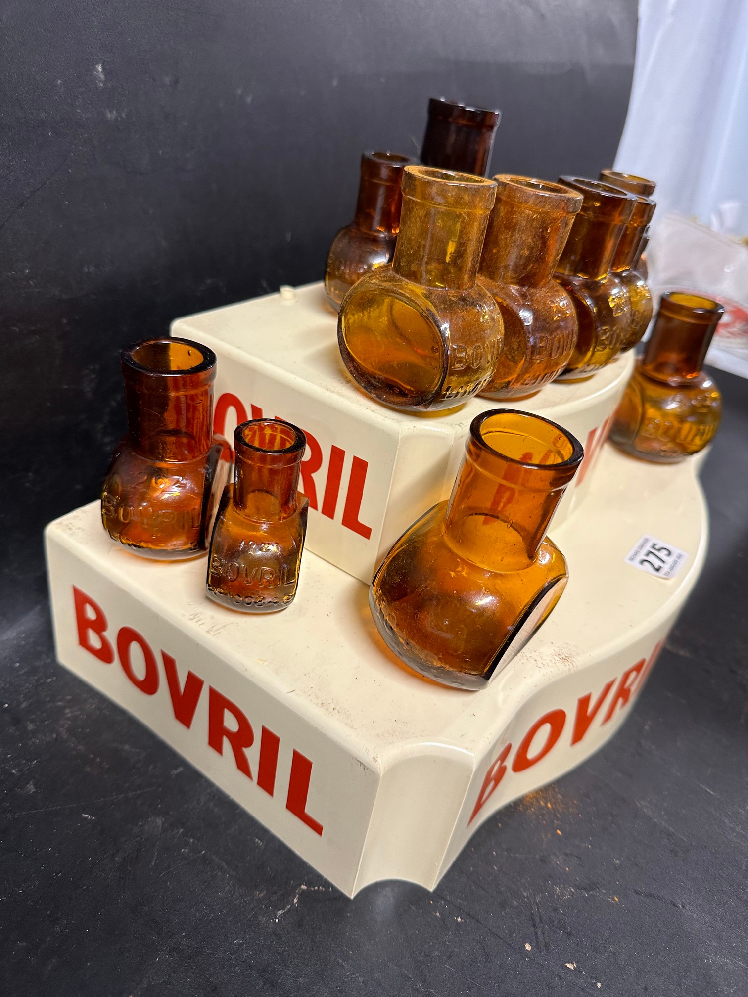 A two tier plastic Bovril shop display stand with associated glass bottles. - Image 2 of 4