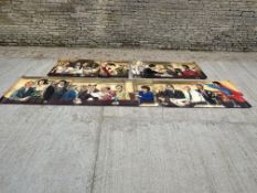 A four-piece banner depicting various characters reading Maxwell's Restaurant menu.