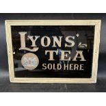 A Lyons' Tea Sold Here glass advertising sign, framed, 16 1/2 x 11 1/2".