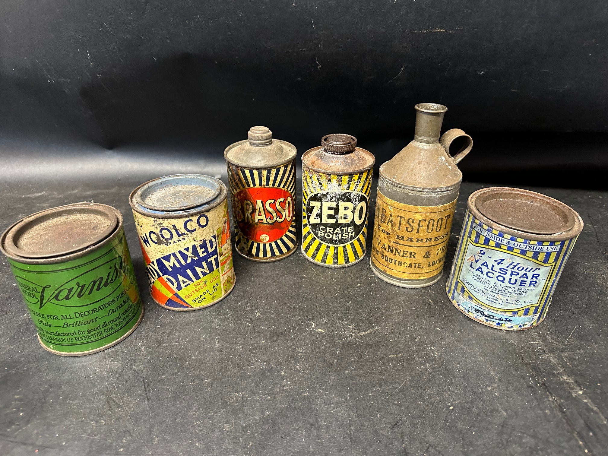 Six tins: Brasso, Zebo, Woolco paint, Nalspar, varnish and Neatsfoot Oil.