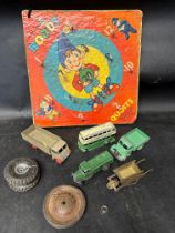 A 1956 Noddy quoits, a selection of playworn Dinky toys and a W&P brass model wheelbarrow.