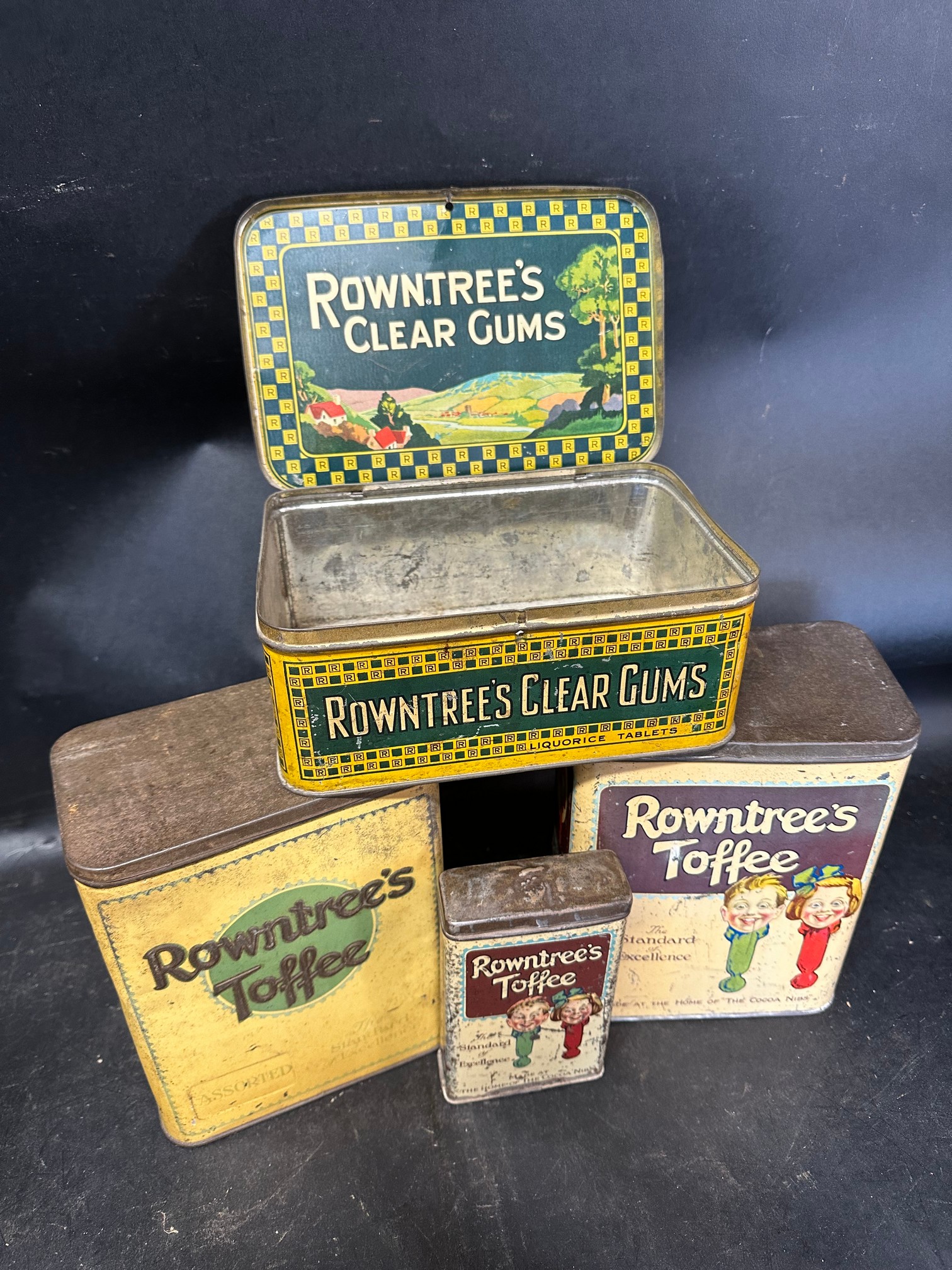 Four Rowntree's confectionery tins: three for Rowntree's Toffee and a Clear Gums Liquorice Tablets