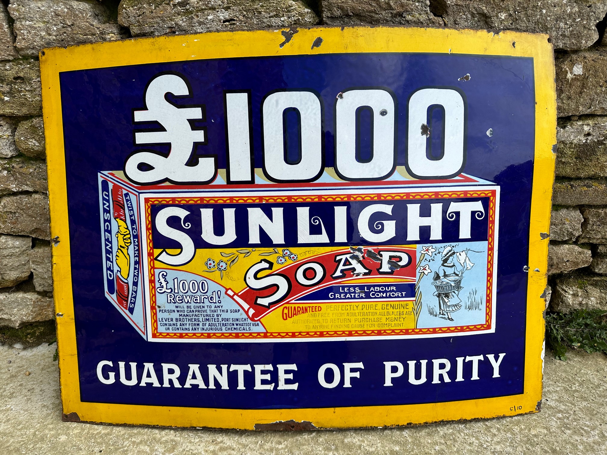 A Sunlight Soap £1,000 Guarantee of Purity pictorial enamel advertising sign, 36 x 27".