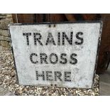 Trains Cross Here - a cast aluminium road sign with pole mounts, some glass reflector beads present,