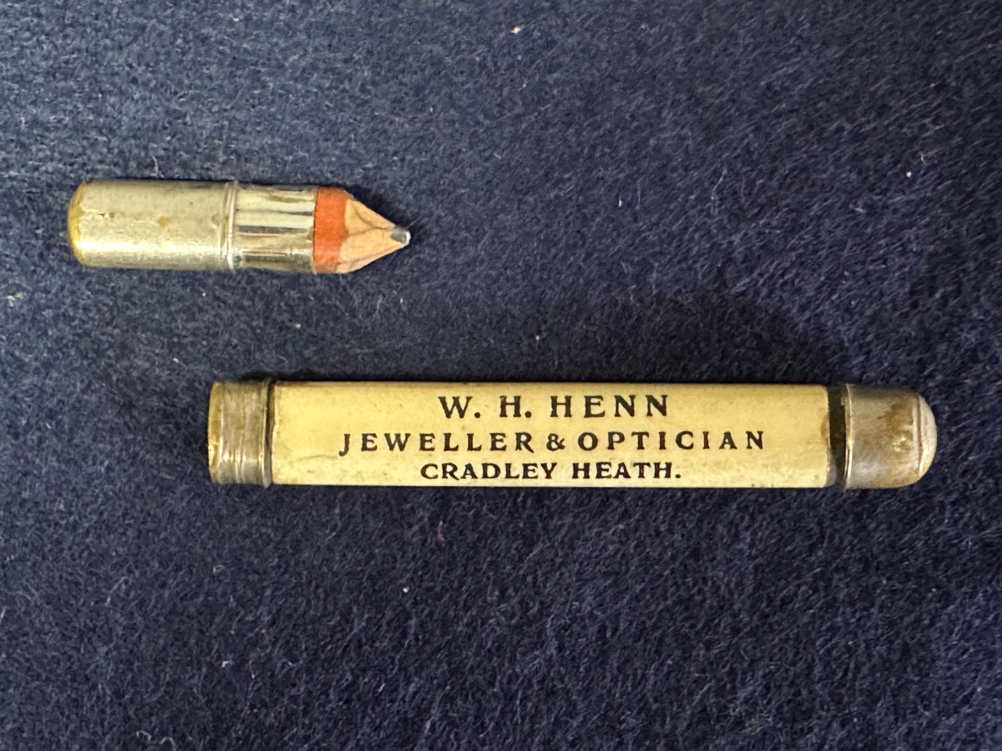 A pencil advertising W.H. Henn Jeweller & Optician, Cradley Heath - Quality & Value in Diamond