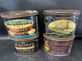Four 1920s large toffee tins: Mackintosh's Toffee Deluxe, Thorne's of Leeds, Waller's Toffee with