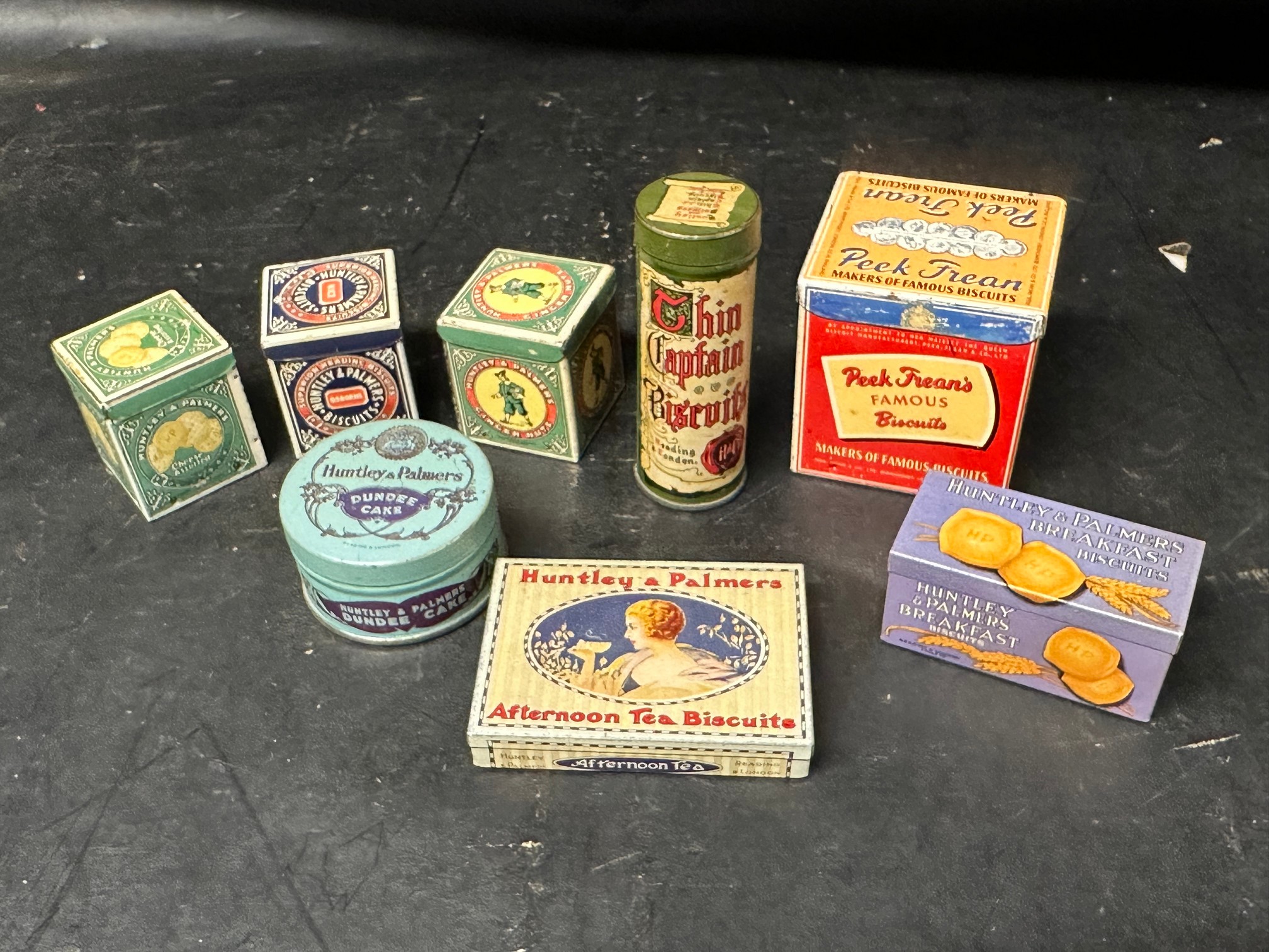 A good selection of confectionery tins, some with contents including Huntley & Palmers, Peek