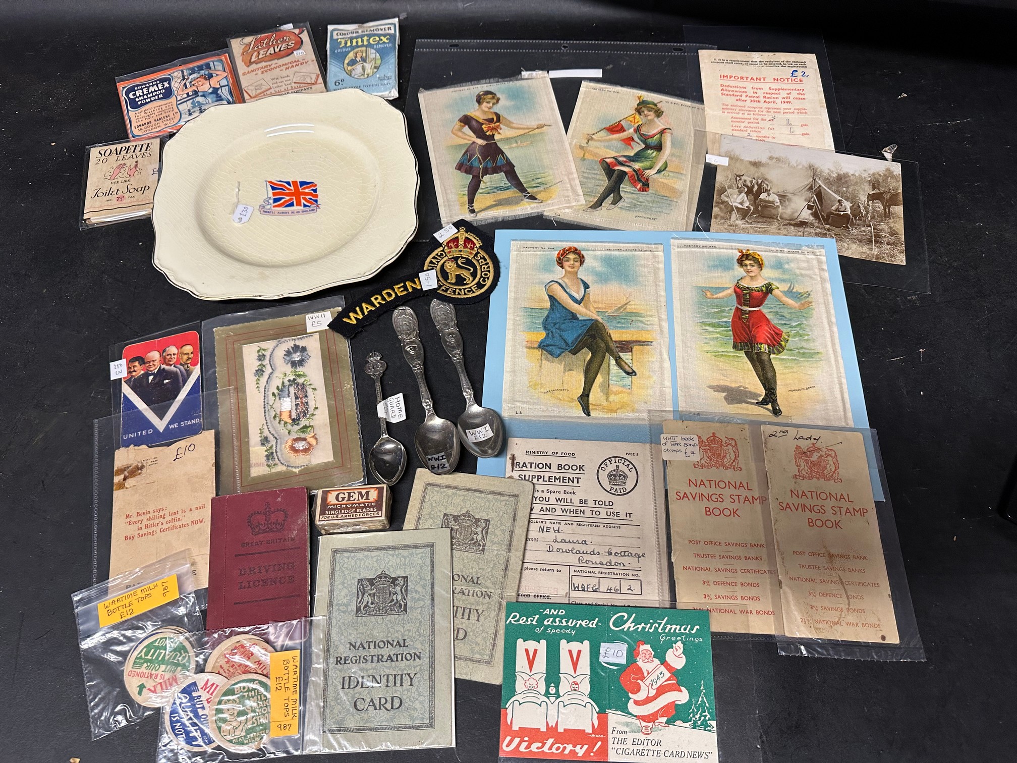 A good WWI and WWII lot including a J & G Meakin WW1 plate, four silks, savings books, a ration