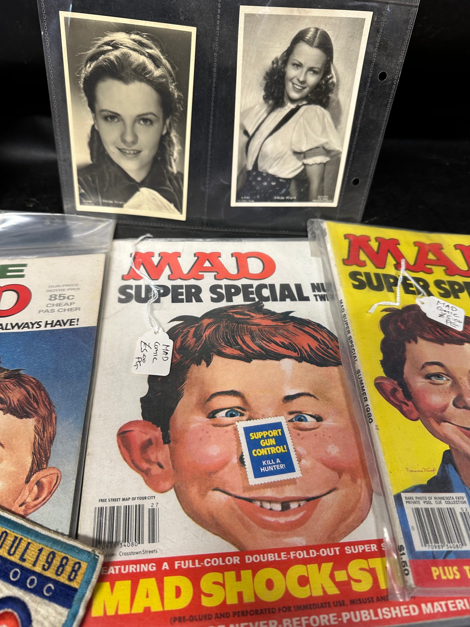 Three 1980s MAD comics, a selection of postcards, a Lincoln Imp, glass model cars etc. - Bild 4 aus 5