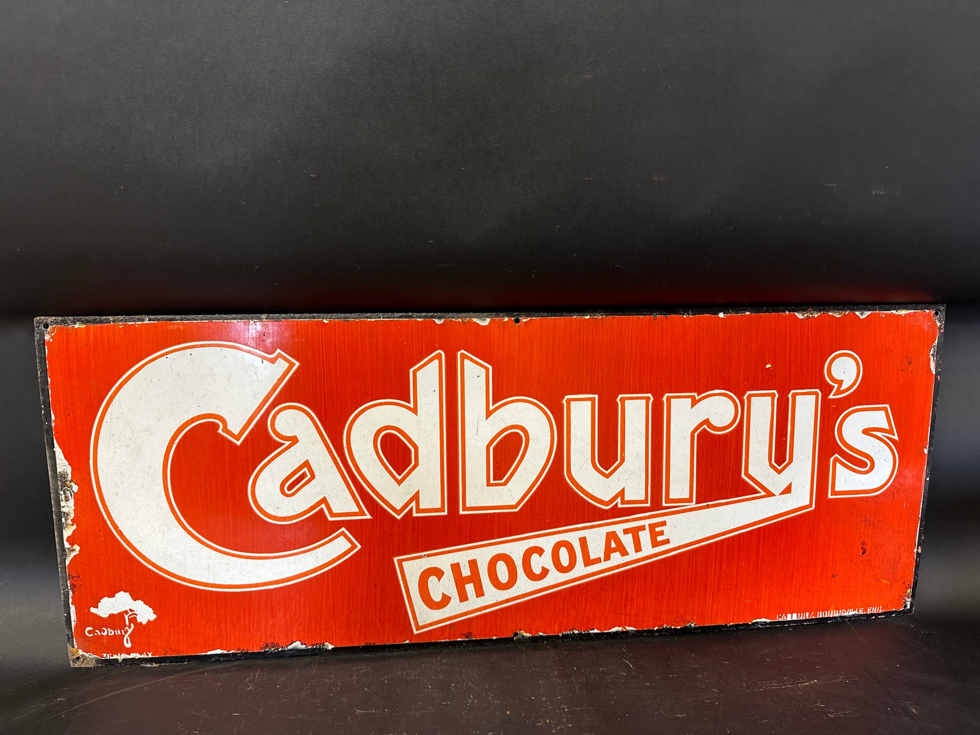 A Cadbury's Chocolate enamel advertising sign for Cadbury Bourneville, 36 x 14".