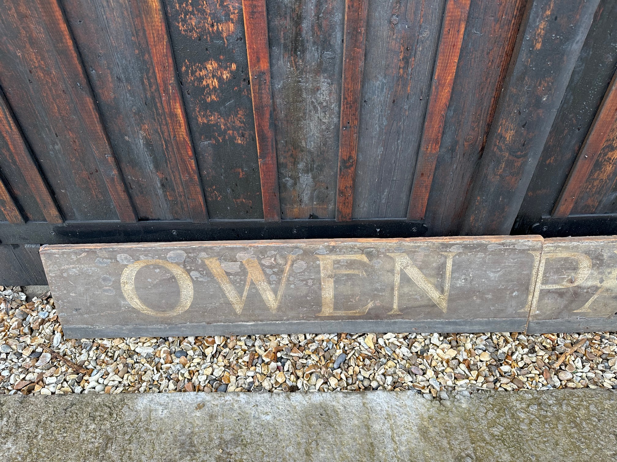 Two parts of a wooden hand painted Welsh advertising sign 'Owen Parry', 48 x 10 1/2" each. - Image 2 of 3
