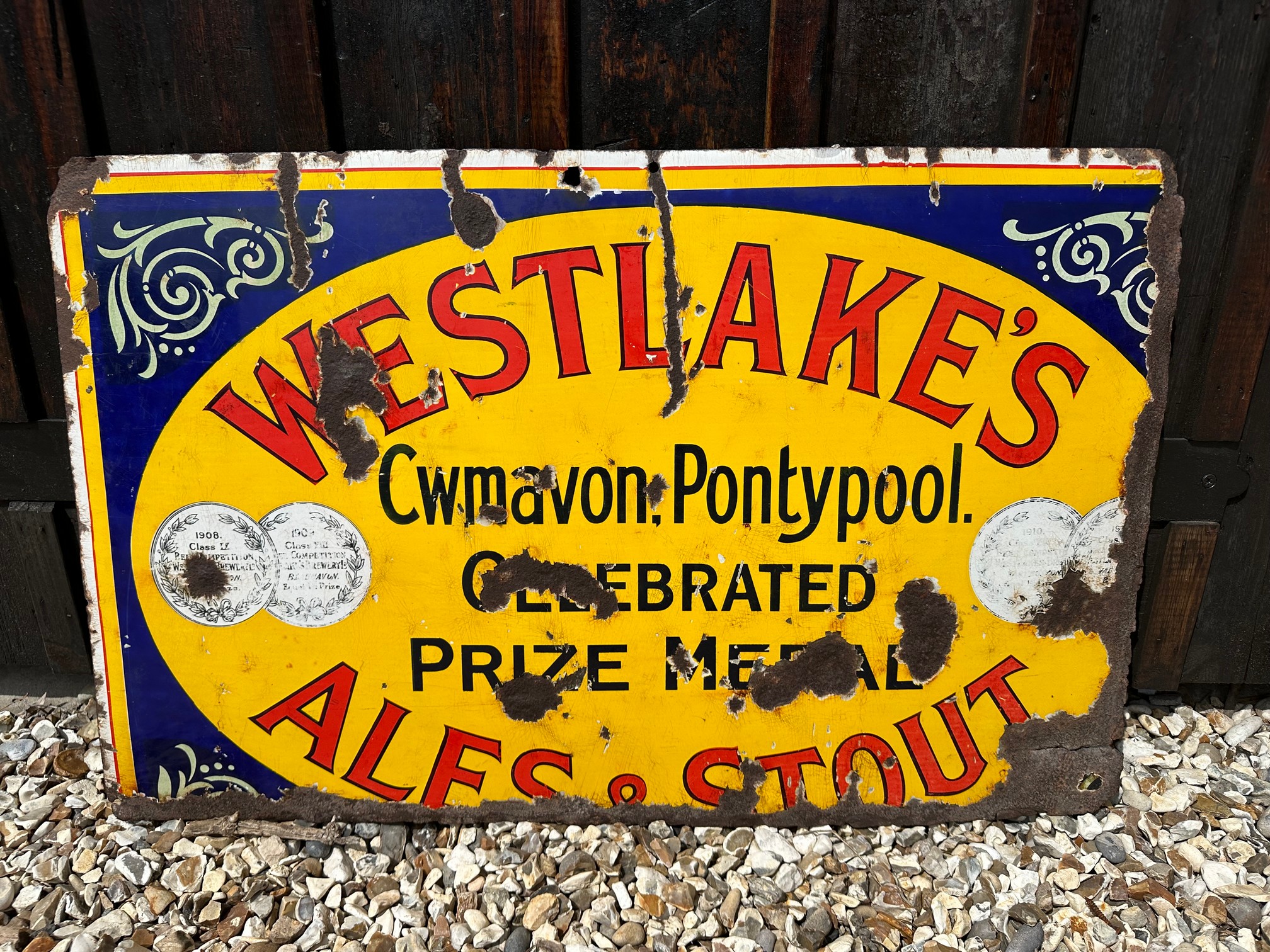 A rare Westlake's Ales & Stout of Cwmavon, Pontypool enamel advertising sign, 32 1/2 x 20 1/2".