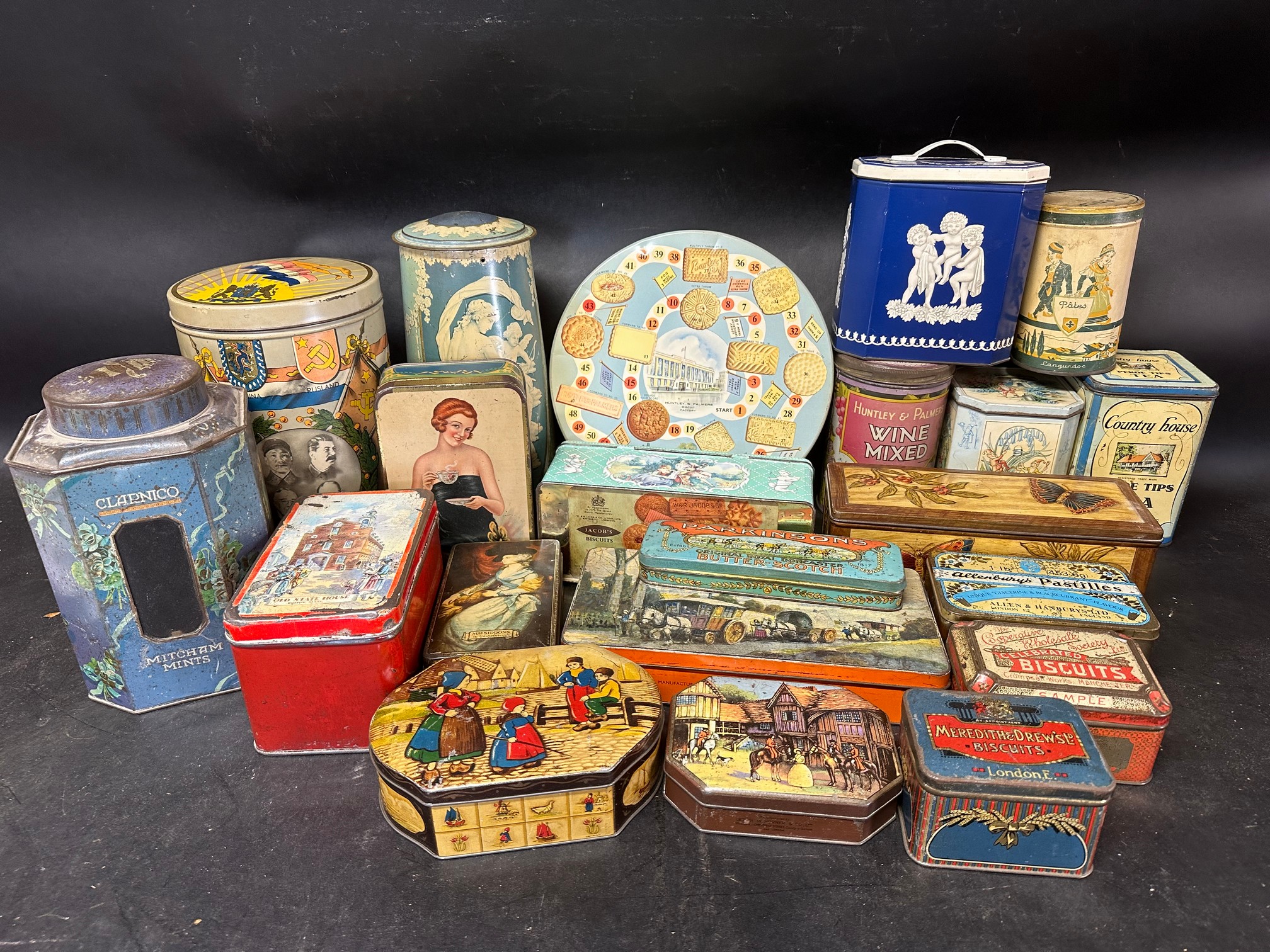 Two trays of confectionery tins inc. Huntley and Palmers, Clarnico, G W Horner, Macfarlane, Lang &