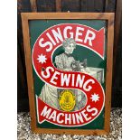A Singer Sewing Machines enamel advertising sign in wooden frame, 25 3/4 x 37 1/2".