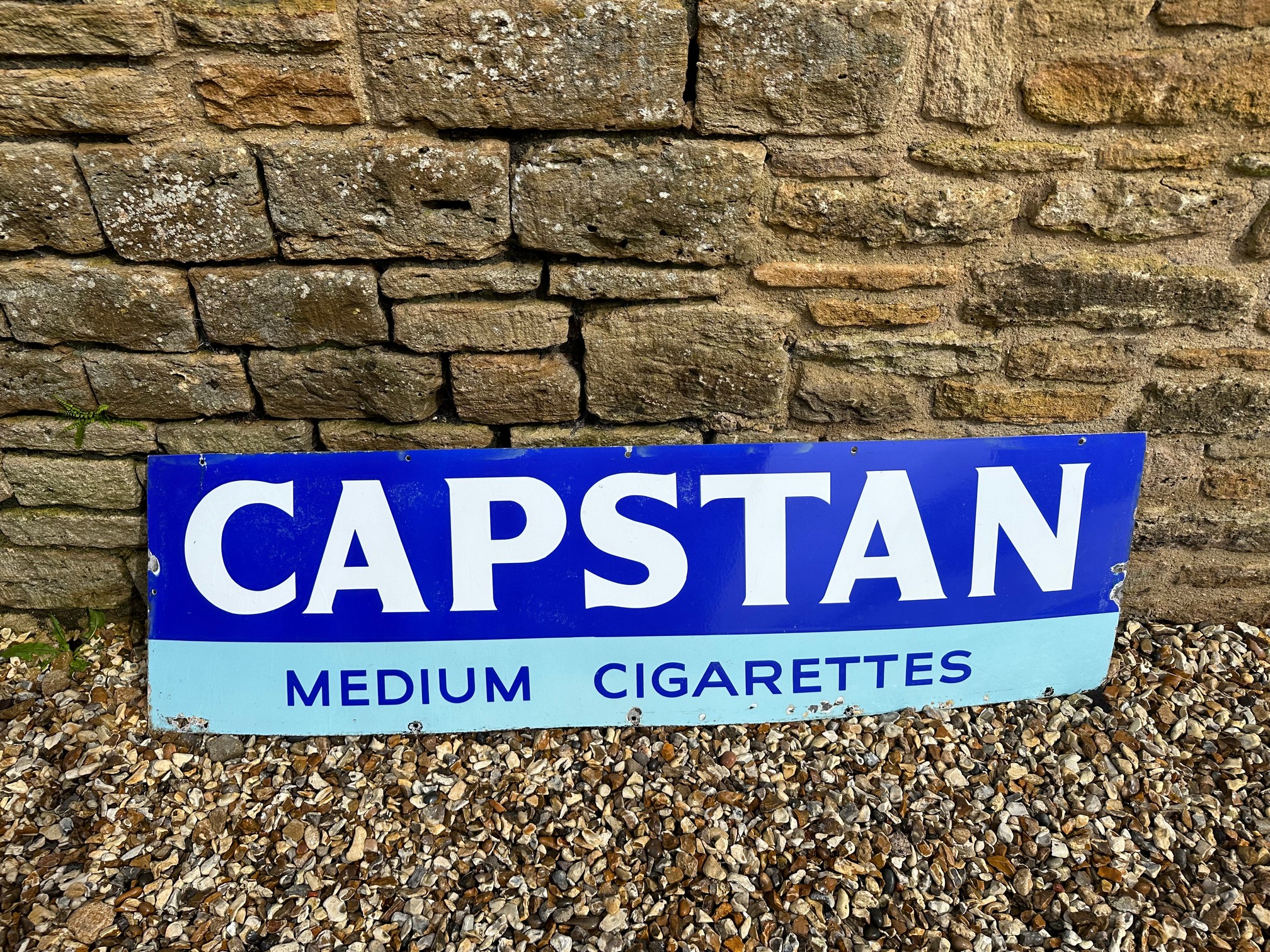 A Capstan Medium Cigarettes enamel advertising sign, 60 x 17".