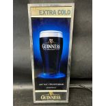 A Guinness Draft Extra Cold illuminated point of sale advertising piece, plug removed, 6 1/2 x 17