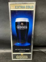 A Guinness Draft Extra Cold illuminated point of sale advertising piece, plug removed, 6 1/2 x 17