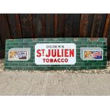 An Ogden's St. Julien Tobacco enamel advertising sign by Imperial Tobacco Co., 60 1/4 x 18".