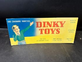 A Dinky Toys shop display showcard, 18 x 7 1/2".