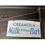 A Creamola Milk Foam Bar double sided enamel sign hanging from a wall bracket, 30 x 21"