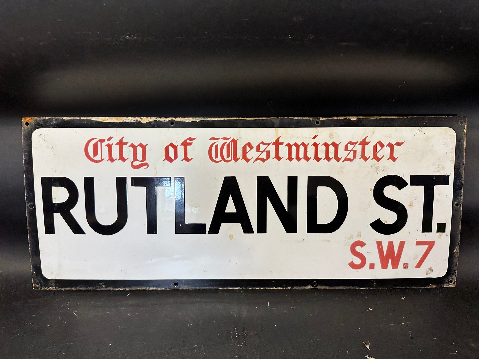 A City of Westminster enamel road sign for Rutland St. S.W.7, 30 x 12".