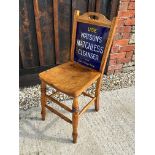 An enamel backed chair advertising Watson's Matchless Cleanser to front and Sparkla Soap to rear, by