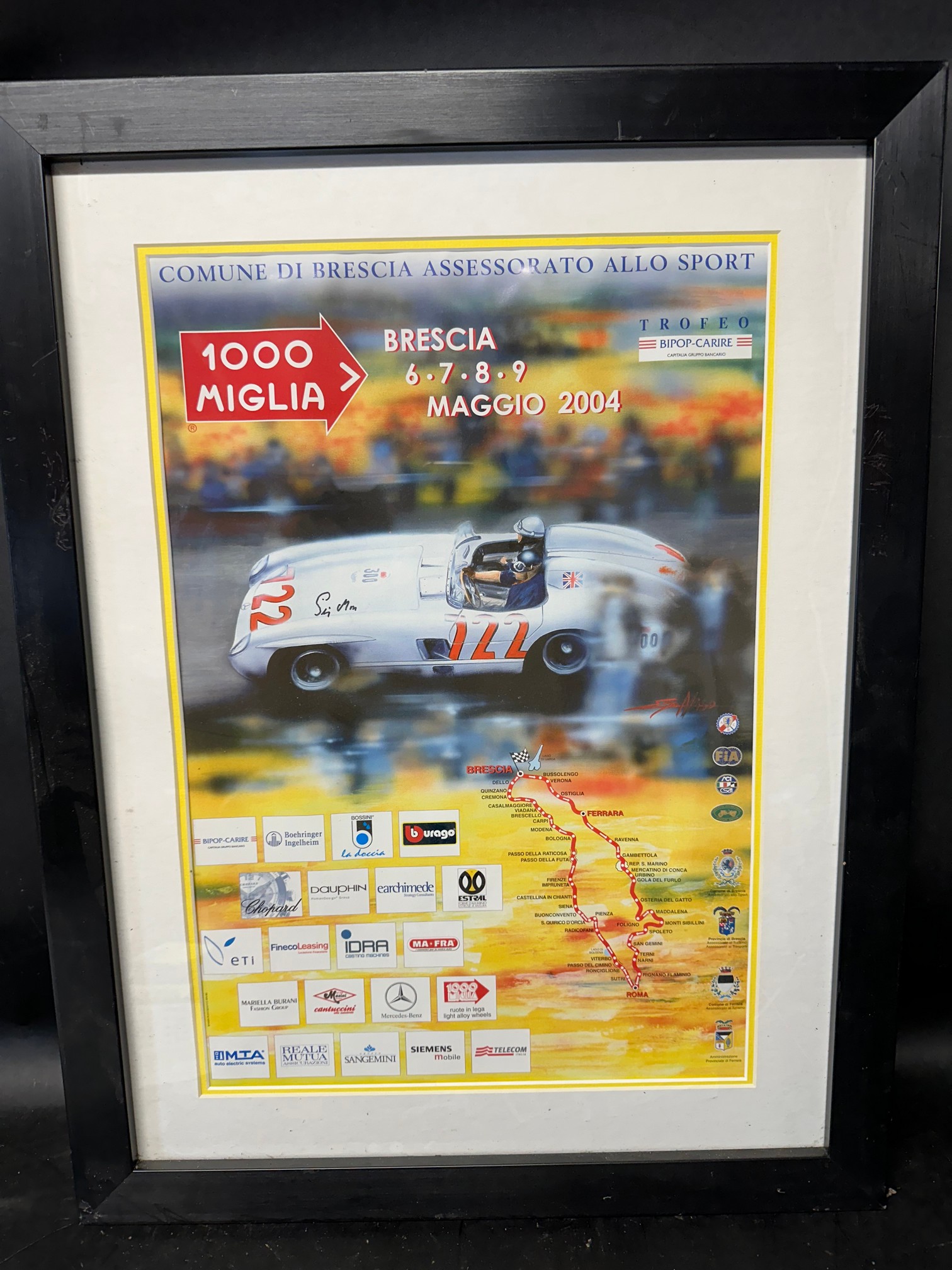 A mounted, framed and glazed poster for the 2004 1000 Miglia, 20 x 26".