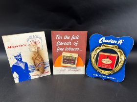 Three tobacco cigarette showcards: Craven "A", Capstan Navy Cut and Morris's Ship's Plug.