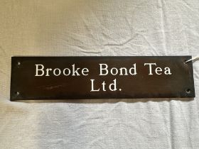 A Brooke Bond Tea Ltd. brass door push/plaque, 9 1/2 x 2 1/4".