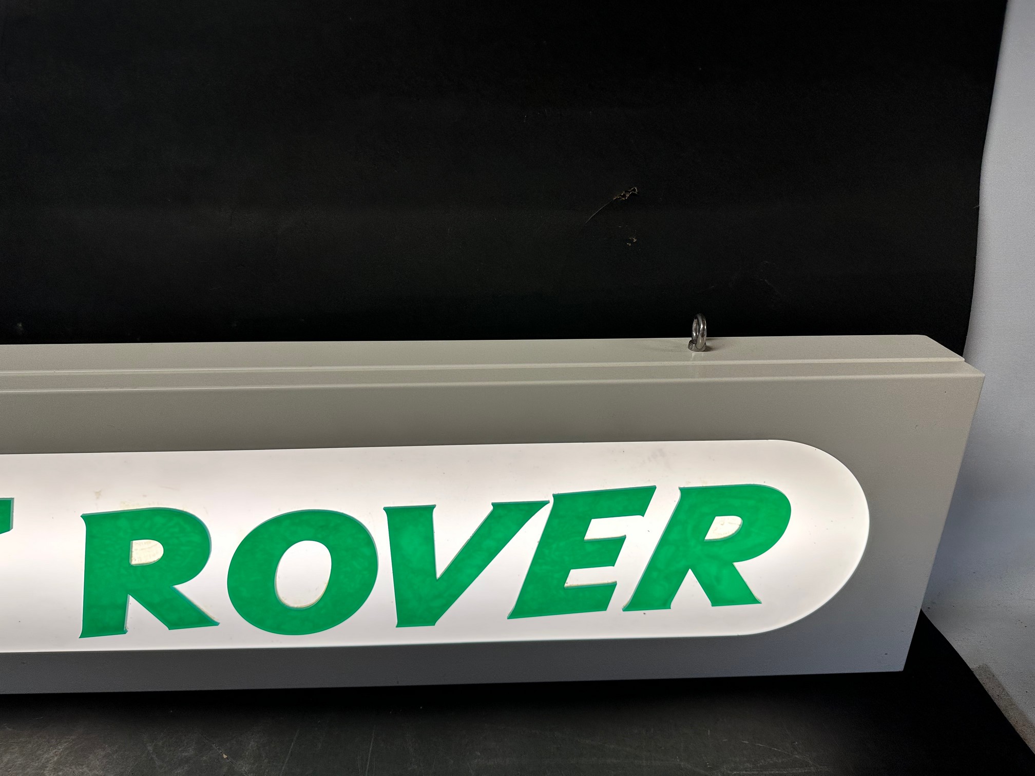 A hanging lightbox with Land Rover applied in acrylic letters, 47 1/4 x 9 x 2 3/4". - Image 4 of 5