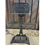 A Sunlight Soap and Lifebuoy Soap umbrella stick stand, 29" tall.