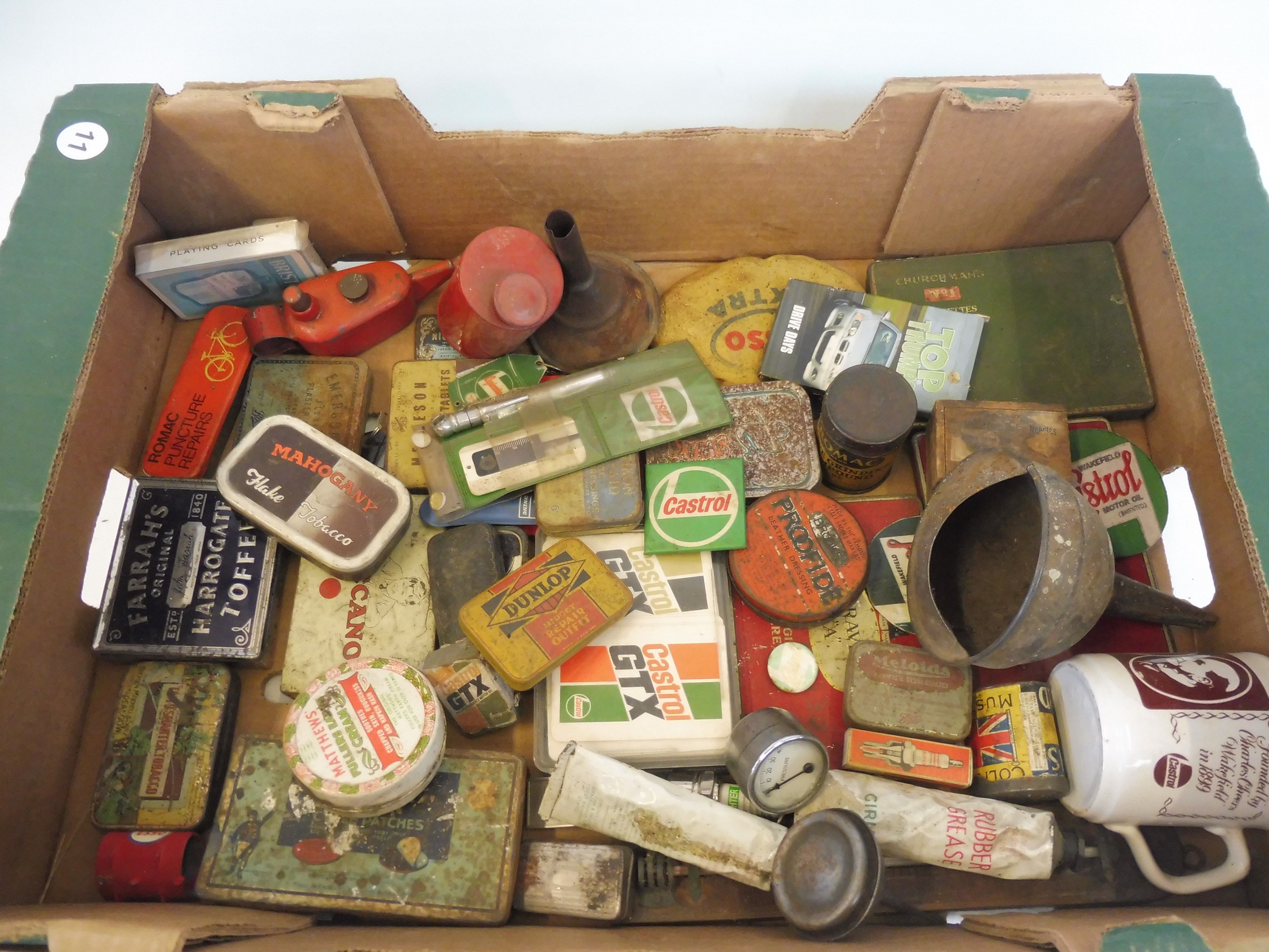 A tray of mixed oil cans, tins and automobilia etc.