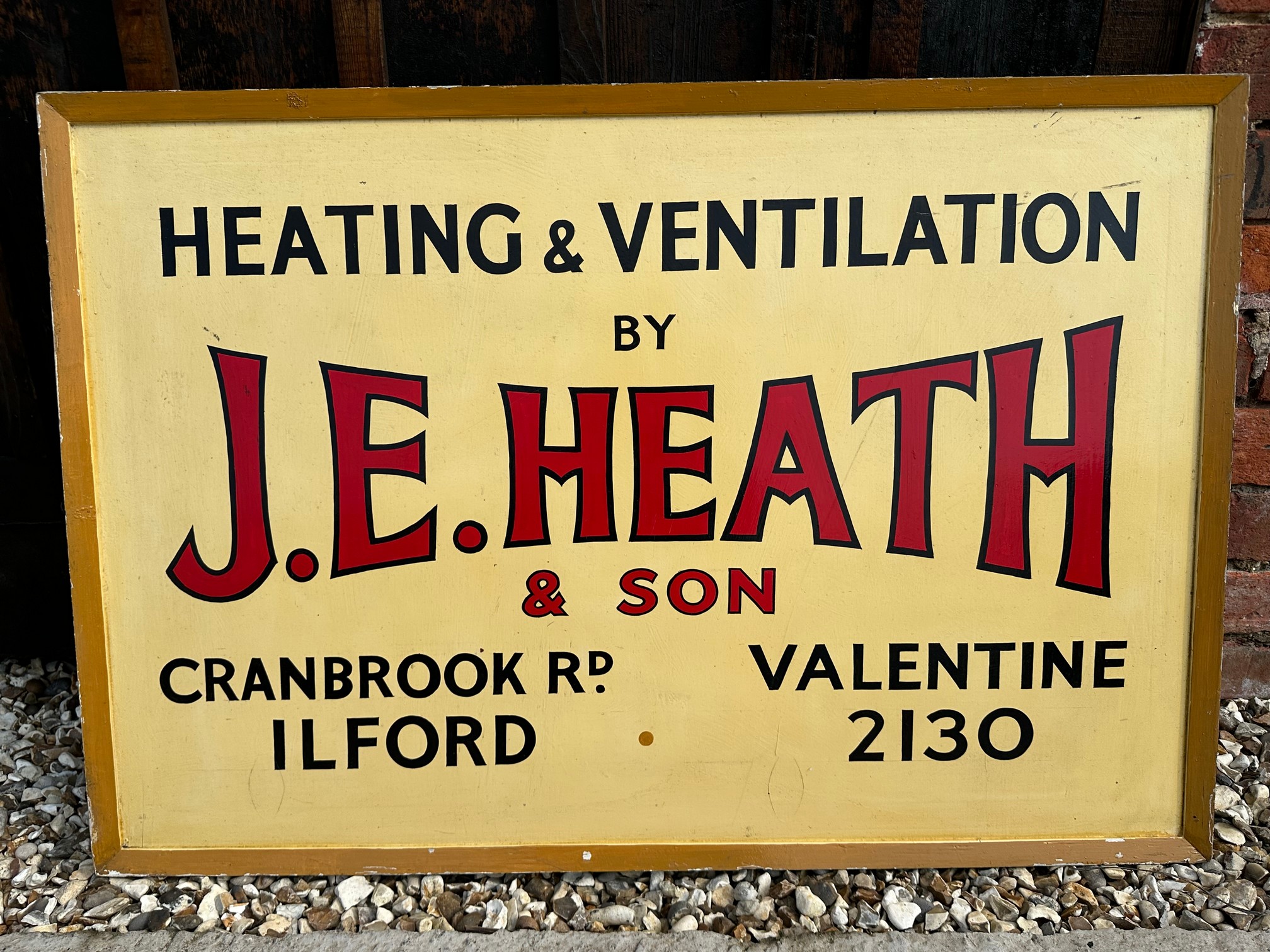 A J.E. Heath & Son Heating and Ventilation of Ilford wooden advertising sign, 38 x 25 3/4".