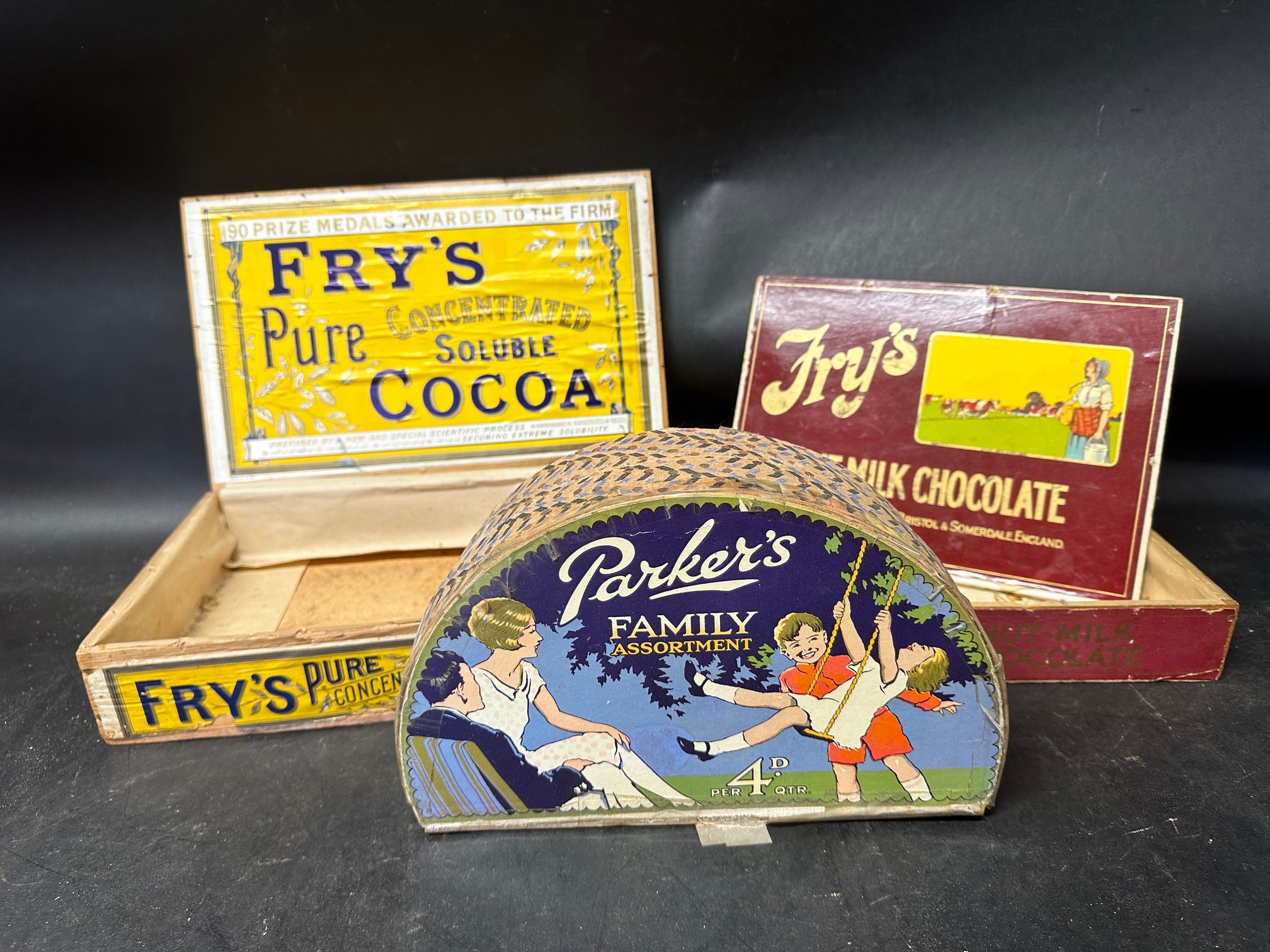 Two Fry's wooden counter top dispensing boxes: Fry's Pure Cocoa and Fry's Nut-Milk Chocolate and a