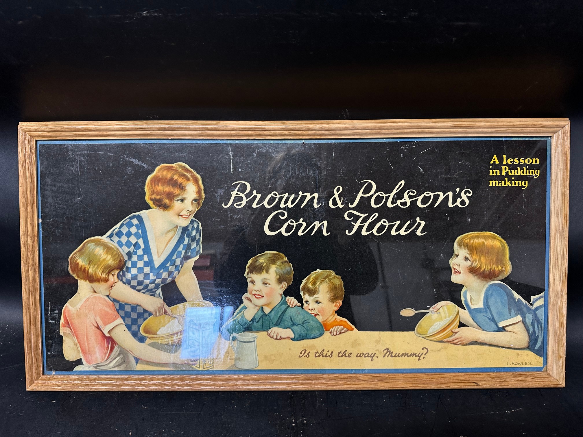 A Brown & Polson's Corn Flour showcard: A lesson in Pudding making, framed and glazed, 26 1/4 x 13