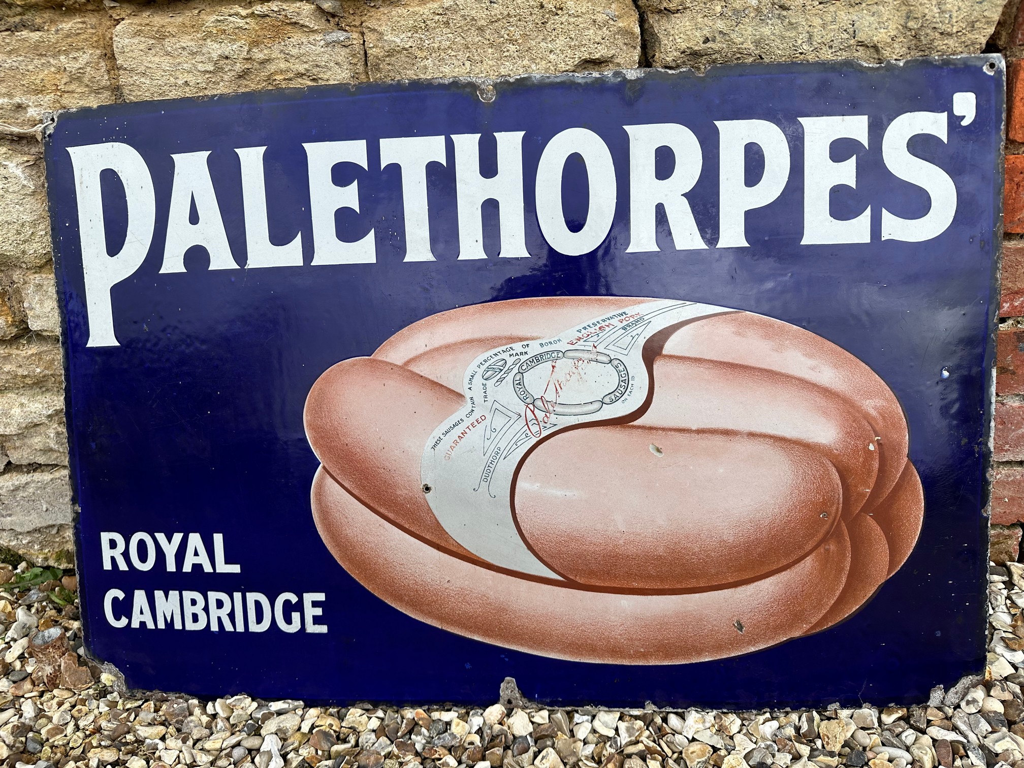 A Palethorpes' Royal Cambridge (sausages) pictorial enamel advertising sign, 36 x 24".