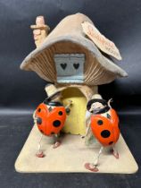 A shop display countertop figurual piece advertising Ladybird House (Children's clothes), 15 3/4"