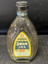 A large retailer's Swan Ink "for all pens" glass bottle, 10" tall.