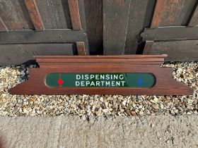 A chemist's cabinet pediment 'Dispensing Department', 38 x 8 1/2".