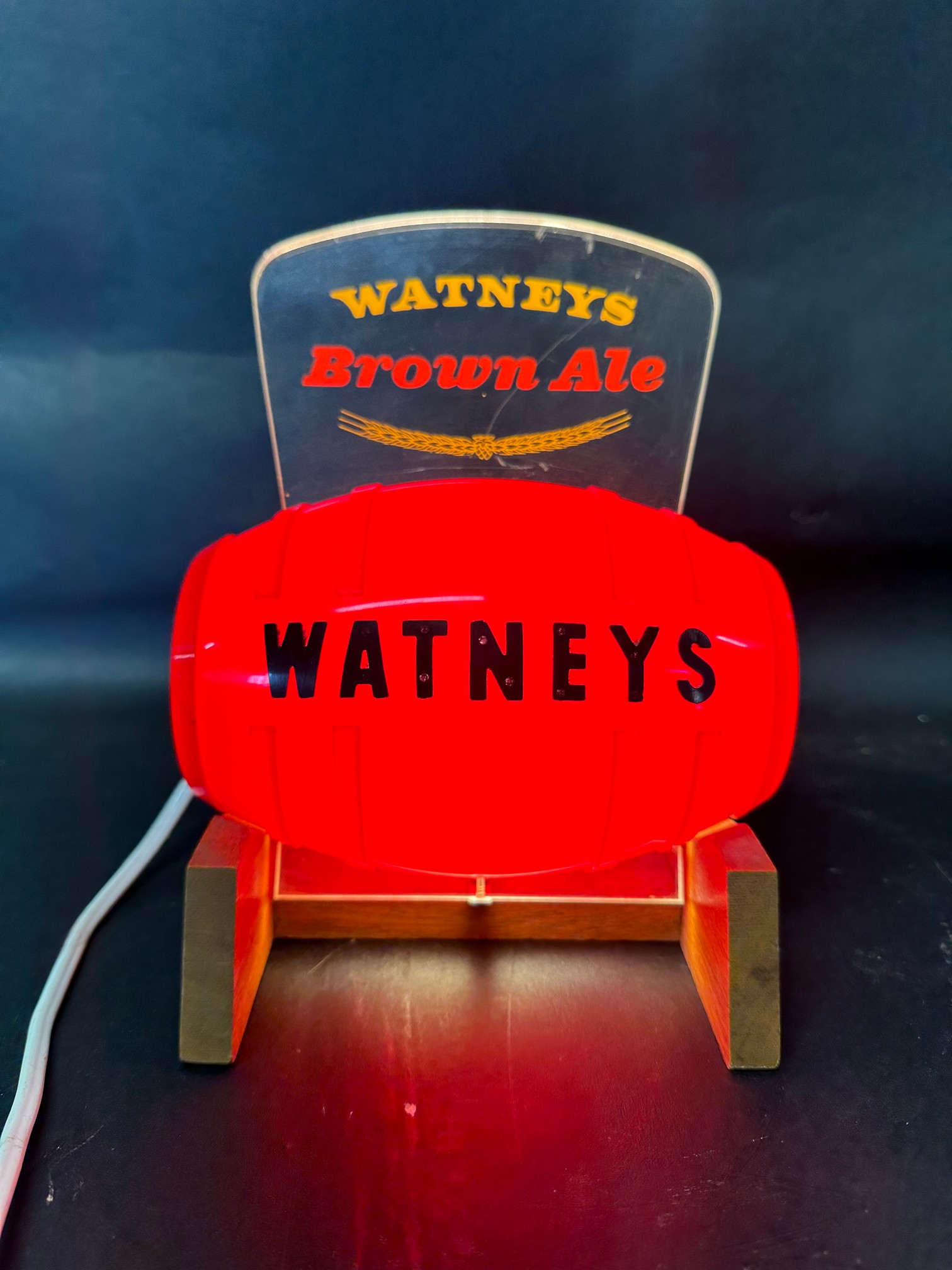 A Watney's Brown Ale bar top advertising light in the form of a beer barrel.