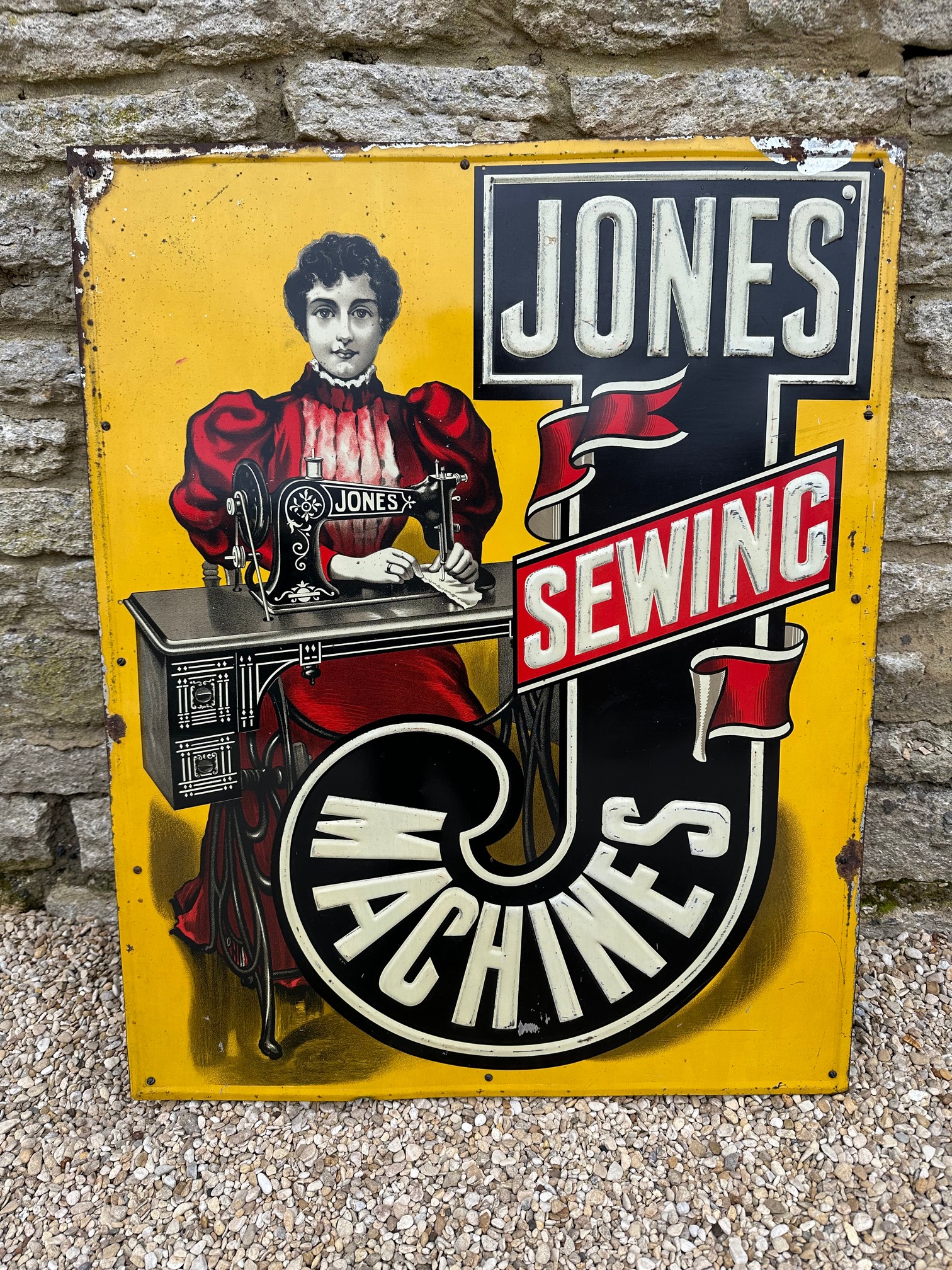 An early Jones' Sewing Machines tin advertising sign with raised lettering, 24 x 29 3/4".